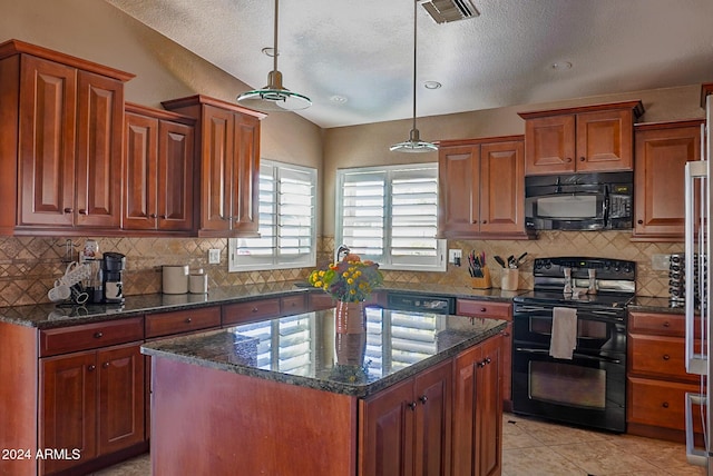 kitchen featuring decorative light fixtures, tasteful backsplash, dark stone counters, a center island, and black appliances