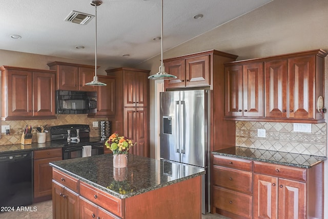 kitchen featuring dark stone countertops, hanging light fixtures, black appliances, a kitchen island, and decorative backsplash