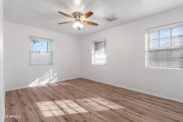 unfurnished room featuring light wood-type flooring, ceiling fan, and a healthy amount of sunlight