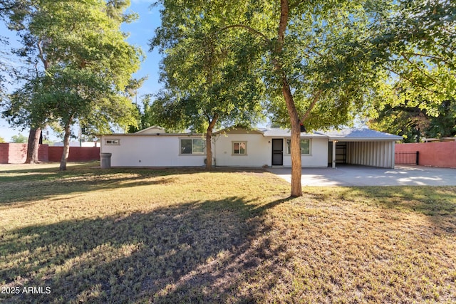 exterior space featuring a patio and a lawn