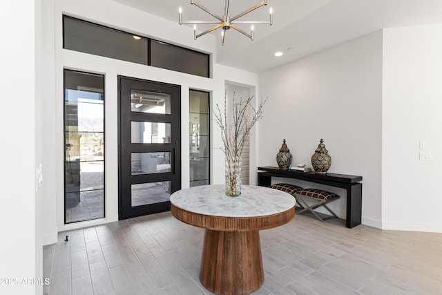 foyer with a notable chandelier