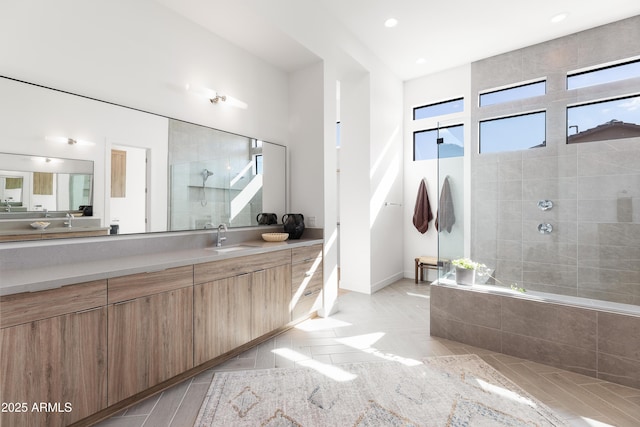 bathroom featuring vanity, separate shower and tub, and tile patterned floors