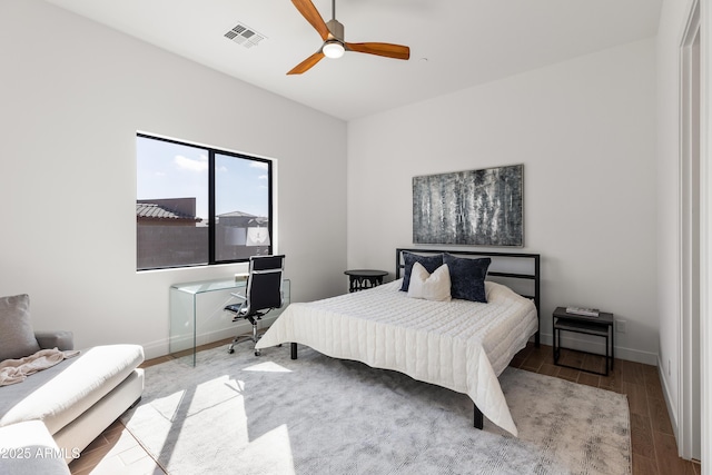 bedroom featuring light hardwood / wood-style floors and ceiling fan