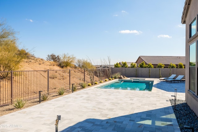 view of swimming pool featuring a patio