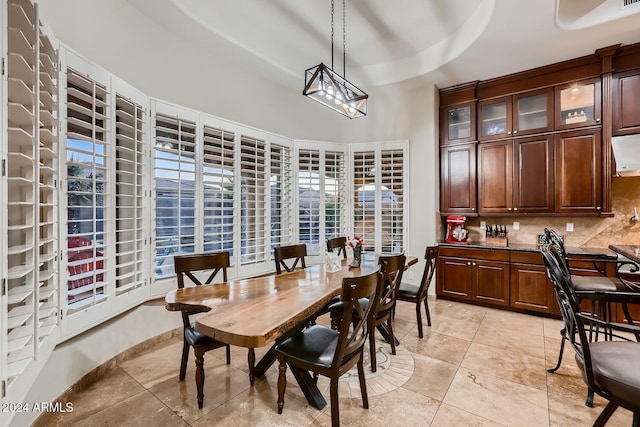 dining area featuring light tile patterned flooring