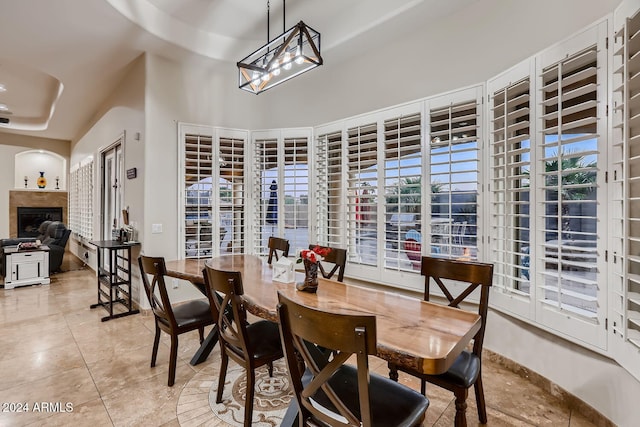 tiled dining space featuring plenty of natural light