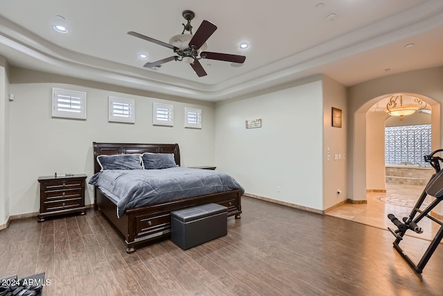 bedroom with wood-type flooring and ceiling fan