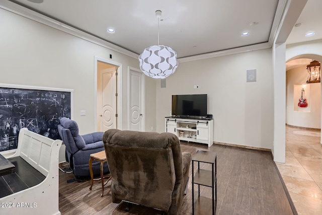 living room with hardwood / wood-style flooring and ornamental molding