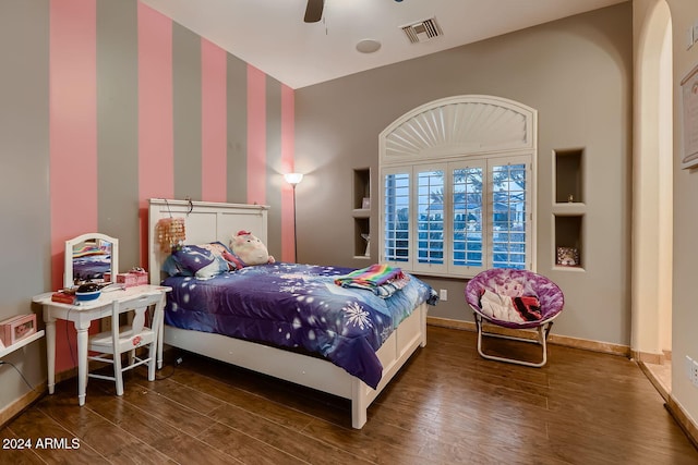 bedroom with ceiling fan and dark wood-type flooring