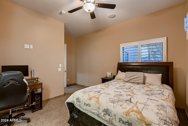 bedroom featuring ceiling fan and light carpet