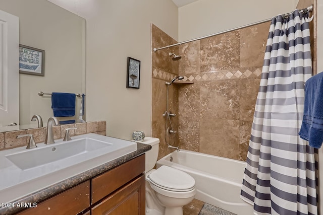 full bathroom featuring vanity, shower / bath combo, and toilet