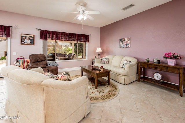 living room with ceiling fan and light tile floors