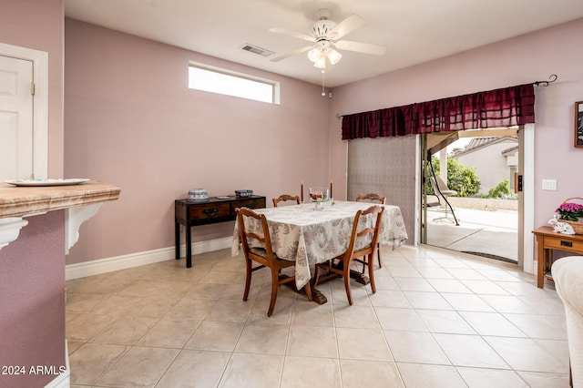 dining area with plenty of natural light, ceiling fan, and light tile floors