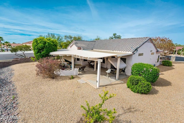 back of property with a patio area