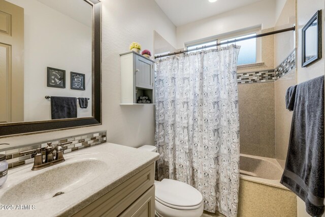 full bathroom featuring decorative backsplash, toilet, vanity, and shower / bath combo