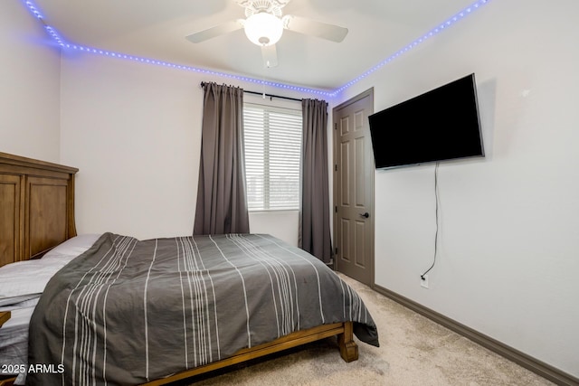 bedroom with baseboards, carpet floors, and ceiling fan