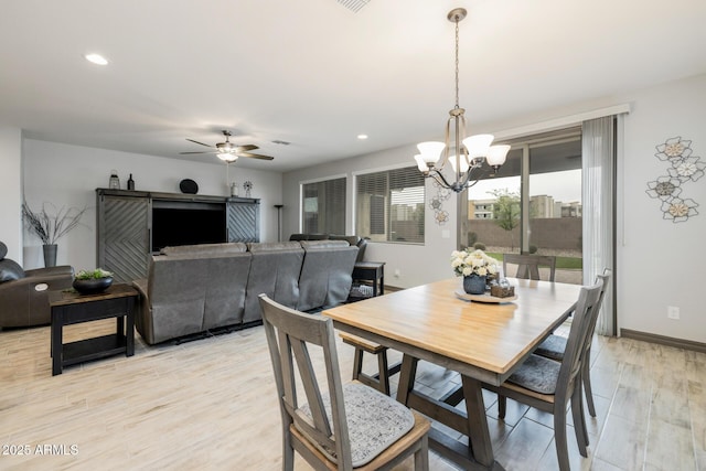 dining room with recessed lighting, baseboards, ceiling fan with notable chandelier, and light wood finished floors