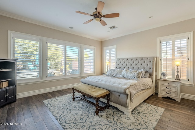 bedroom with dark wood-type flooring and multiple windows