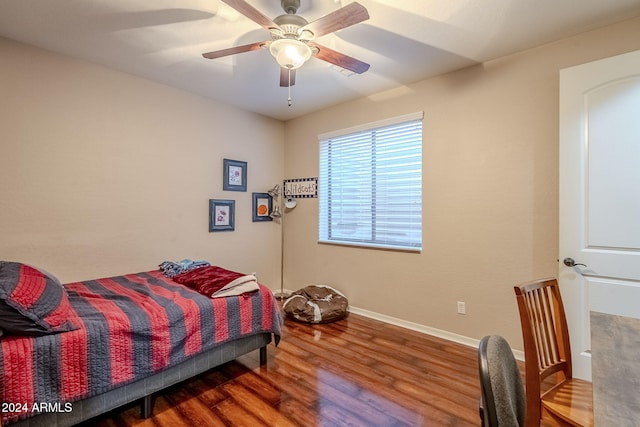 bedroom featuring hardwood / wood-style flooring and ceiling fan