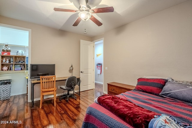 bedroom featuring dark hardwood / wood-style floors and ceiling fan