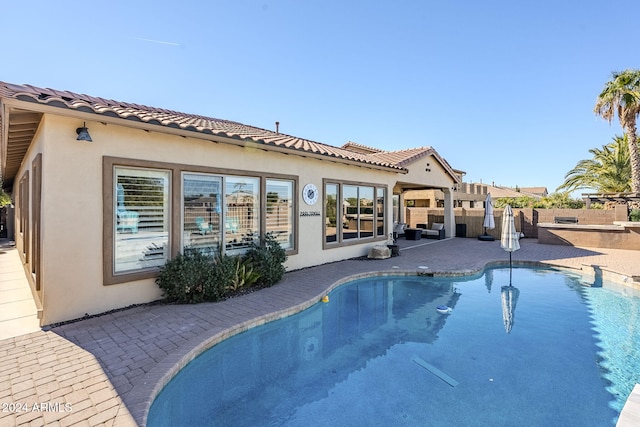 view of pool featuring a patio