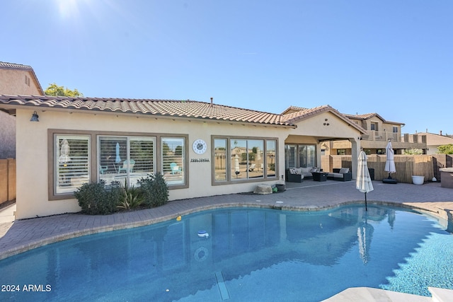 view of swimming pool featuring outdoor lounge area and a patio area