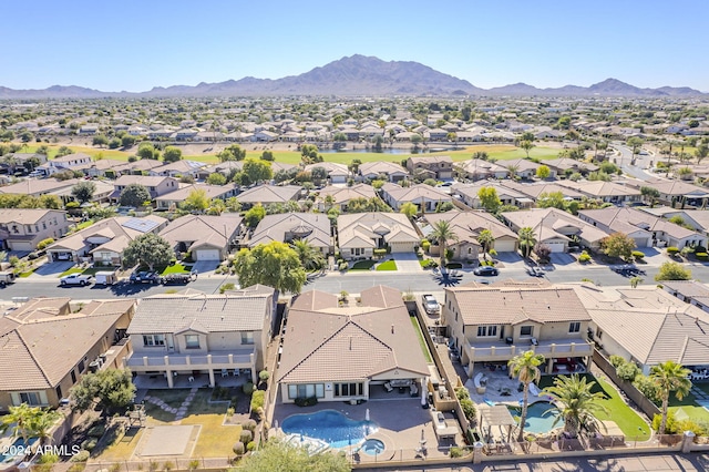 birds eye view of property with a mountain view