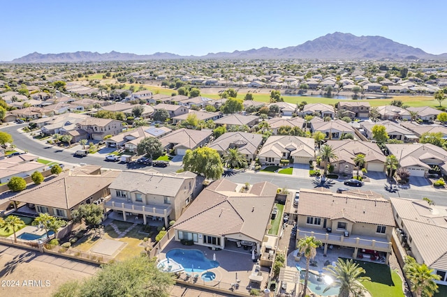 birds eye view of property with a mountain view