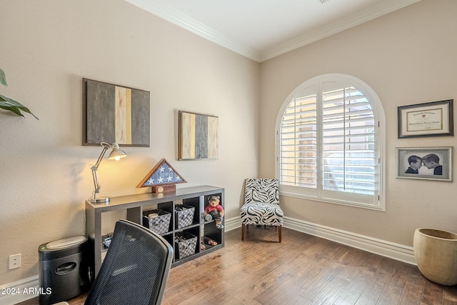 home office featuring ornamental molding and hardwood / wood-style flooring