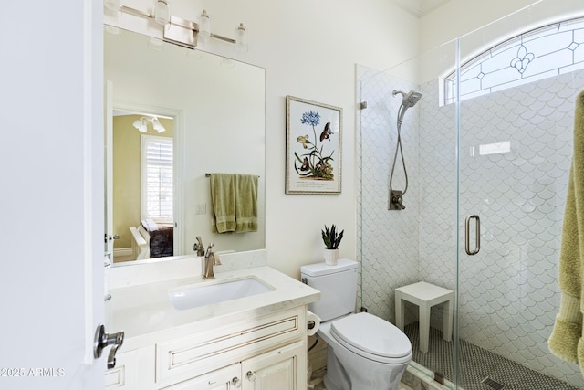 bathroom with a healthy amount of sunlight, a shower stall, and toilet