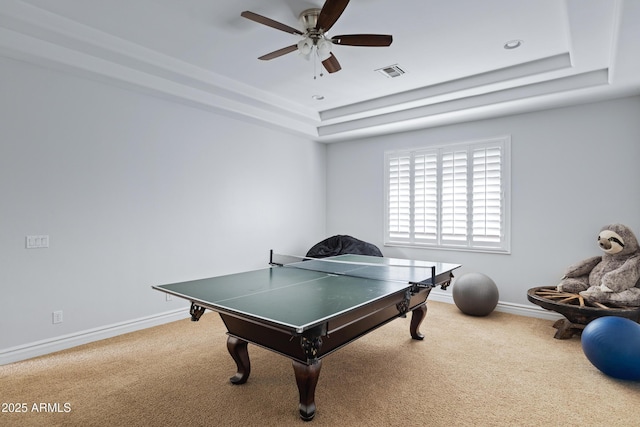 playroom with baseboards, visible vents, a tray ceiling, and carpet flooring