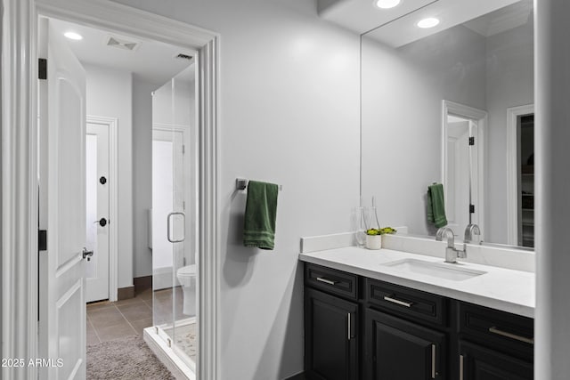 bathroom featuring visible vents, a shower stall, vanity, and tile patterned floors