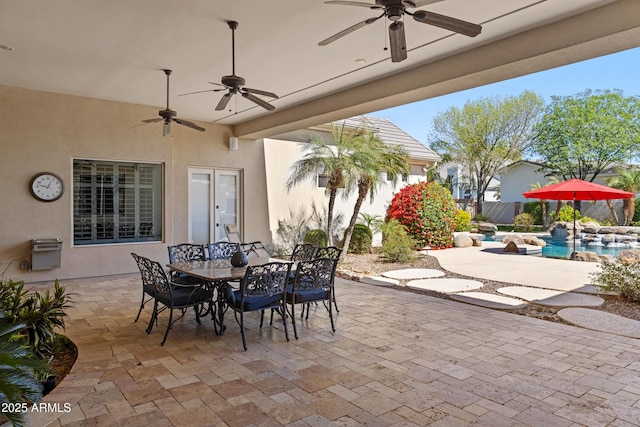 view of patio featuring outdoor dining area and fence