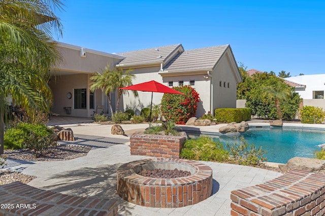 exterior space featuring a fenced in pool and a patio area