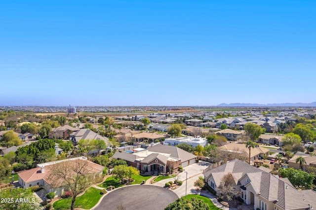 drone / aerial view featuring a mountain view and a residential view