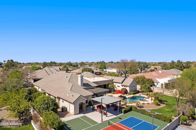 birds eye view of property with a residential view