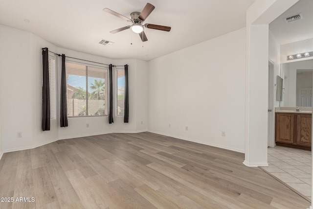 15429 W Ventura St, Surprise, AZ 85379 - spare room featuring light wood-type flooring and a ceiling fan