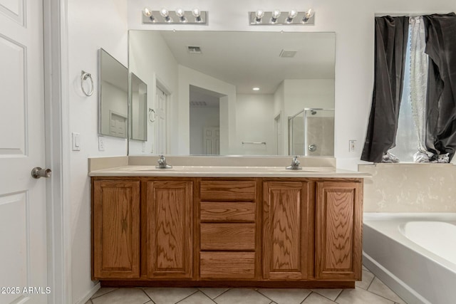 15429 W Ventura St, Surprise, AZ 85379 - bathroom featuring a shower stall, tile patterned floors, a bath, and double vanity