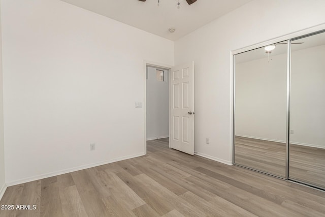 15429 W Ventura St, Surprise, AZ 85379 - unfurnished bedroom featuring light wood-style flooring, a closet, and a ceiling fan