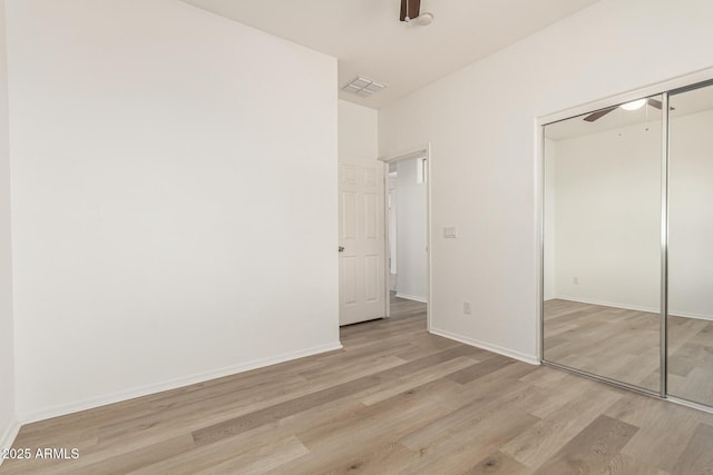 15429 W Ventura St, Surprise, AZ 85379 - unfurnished bedroom with wood finished floors, a closet, and ceiling fan