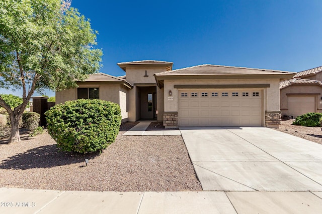 15429 W Ventura St, Surprise, AZ 85379 - view of front of home with a garage, driveway, stucco siding, and a tile roof