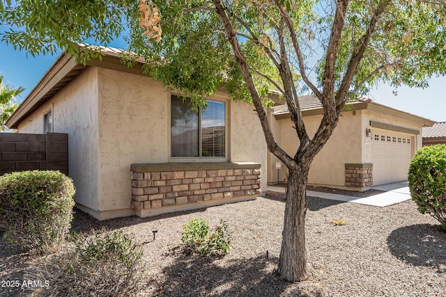 15429 W Ventura St, Surprise, AZ 85379 - view of front of house with stucco siding and a garage