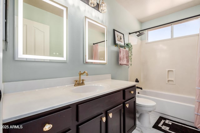 bathroom with vanity, shower / tub combo, toilet, and marble finish floor