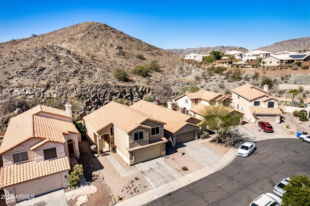 aerial view with a mountain view and a residential view