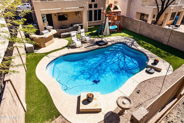 view of swimming pool featuring a fenced backyard, a fenced in pool, a playground, and a patio