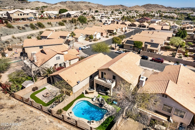 birds eye view of property featuring a mountain view and a residential view