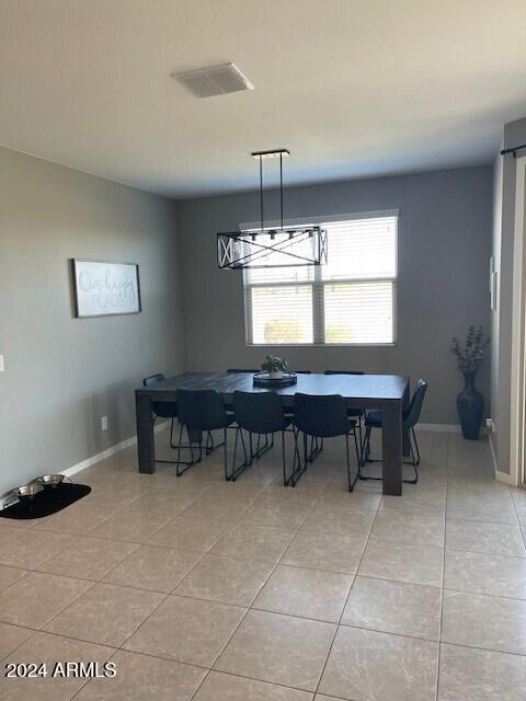 dining area featuring light tile patterned flooring