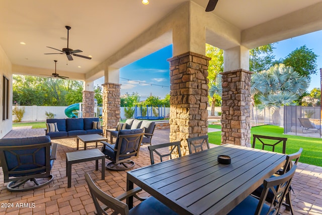 view of patio featuring an outdoor hangout area, a trampoline, and ceiling fan