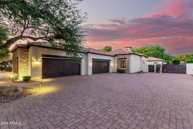 mediterranean / spanish house with a garage