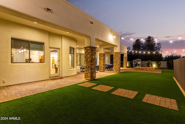 yard at dusk with a patio